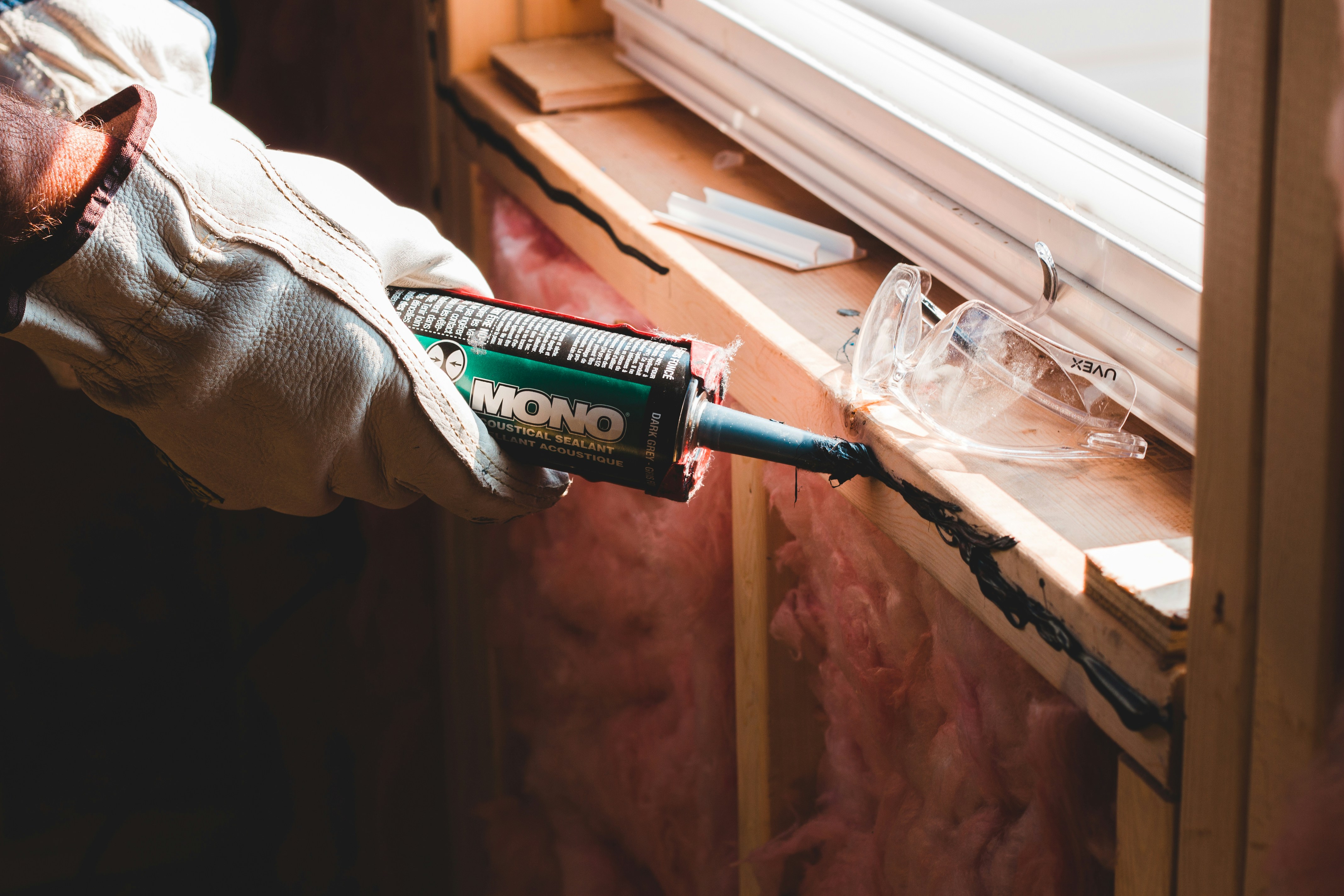 A female plumber working on pipes