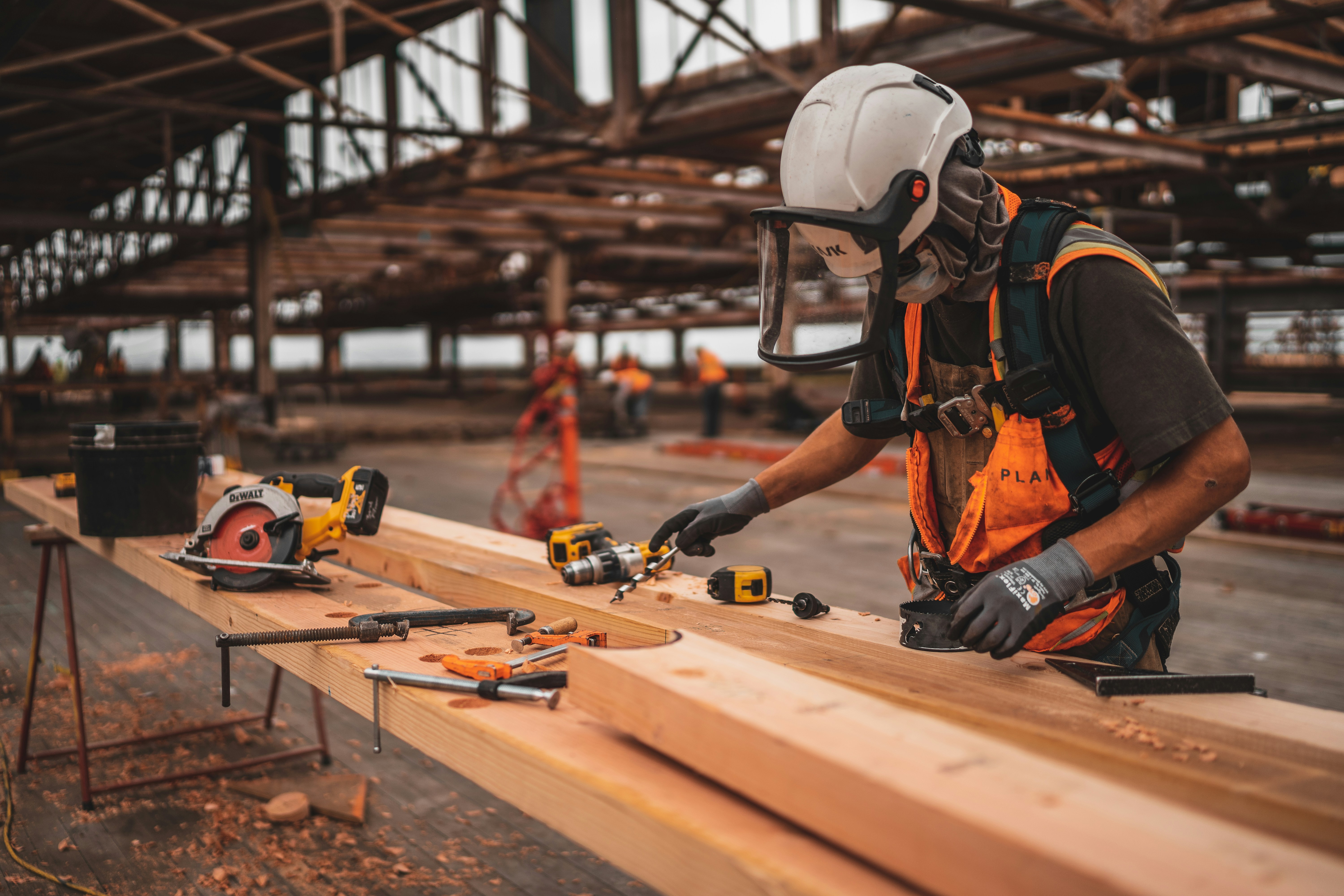 A construction worker laying bricks